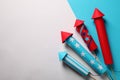 Firework rockets on color background, flat lay with space for text. Festive decor