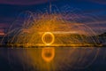 Firework showers of hot glowing sparks from spinning steel wool