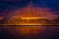 Firework showers of hot glowing sparks from spinning steel wool Royalty Free Stock Photo