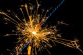 Firework sparkler burning on black background, congratulation greeting party happy new year, christmas celebration