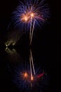 Fireworks above water, mirroring