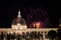 Fireworks bursting over Hotel Dieu in Lyon for French National Holiday, Bastille day, while Basilique de Fourviere Basilica church Royalty Free Stock Photo