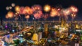 Fireworks celebrating over Chao Phraya river in Bangkok city at night, Thailand