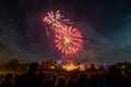 People watching Fireworks display at bonfire 4th of November celebration, Kenilworth Castle, united kingdom. Royalty Free Stock Photo