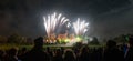 People watching Fireworks display at bonfire 4th of November celebration, Kenilworth Castle, united kingdom. Royalty Free Stock Photo