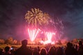 People watching Fireworks display at bonfire 4th of November celebration, Kenilworth Castle, united kingdom. Royalty Free Stock Photo