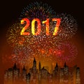 Fireworks display for happy new year 2017 above the city with clock Royalty Free Stock Photo