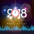 Fireworks display for happy new year 2018 above the city with clock Royalty Free Stock Photo