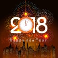 Fireworks display for happy new year 2018 above the city with clock Royalty Free Stock Photo