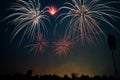 Group of people watching fireworks with music