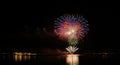 Spectacular Fireworks Display Over Water at Night Royalty Free Stock Photo