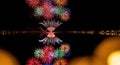 Spectacular Fireworks Reflected on Calm Water at Night Royalty Free Stock Photo