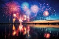 A fireworks display is lit up in the sky over a body of water Royalty Free Stock Photo