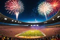 Fireworks Erupting in the Night Sky Above a Stadium Filled with Excited Spectators: Bursts of Color Illuminate the Celebration Royalty Free Stock Photo