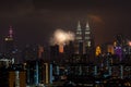 Fireworks explode near Malaysia`s landmark Petronas Twin Towers