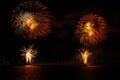 Fireworks explosions with shining sparks on dark background Royalty Free Stock Photo