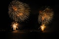 Fireworks explosions with shining sparks on dark background Royalty Free Stock Photo