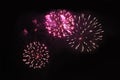 Fireworks. Firework. Heavenly background. Amazing trio of bright red and yellow sparkling lights in the night sky during the Royalty Free Stock Photo