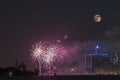 Fireworks with full moon over detroit river Royalty Free Stock Photo