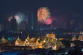 Fireworks glowing behind Grand Palace in Bangkok City, Thailand