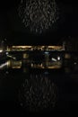 Fireworks by the historic Ponte Vecchio bridge in Florence