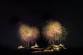 Fireworks with in a holiday events. New Year fireworks on the beach. Cheerful fireworks display in the city, with lots of colorful Royalty Free Stock Photo