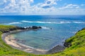 Small hidden beach, view of a shore and blue sky and sea