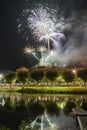 Fireworks at Night over the castle with boats in the river