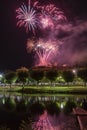 Fireworks at Night over the castle with boats in the river