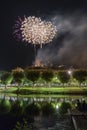 Fireworks at Night over the castle with boats in the river