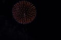 Fireworks in night sky in a composition in shades gold and red Royalty Free Stock Photo