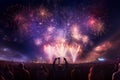 Fireworks over a festival crowd capturing the