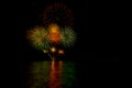 Fireworks over lake. Independence Day fireworks at night. Royalty Free Stock Photo