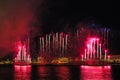 Fireworks over the river. Bright laser show. Holiday in the city Royalty Free Stock Photo