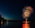 Fireworks over the water on Canada day. Royalty Free Stock Photo