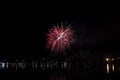 The fireworks paint the sky in various colors and are reflected in the Miseno lake, creating a breathtaking panorama.