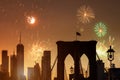Fireworks of a salute in the New York City beautiful sunset manhattan with brooklyn bridge Royalty Free Stock Photo