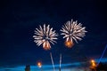 Fireworks in the sky in the form of heart reflection in water