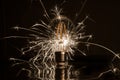 Fireworks sparkler showing through LED light bulb Royalty Free Stock Photo
