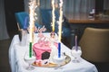 Fireworks on the wedding cake on a white table