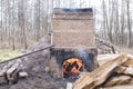 Firing of wood fire kiln is part of process for black pottery