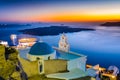 Firostefani, Santorini, Greece. Twilight with old greek church a