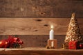 First Advent candle burning on a rustic wooden table Royalty Free Stock Photo