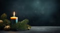 First advent with one burning candle on fir branches with Christmas decoration against a dark grey background, Royalty Free Stock Photo