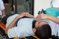 First aid assistance of the ambulance medical team with CPR method and hand-squeezed breathing