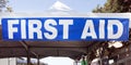 First Aid banner and tent at community street festival