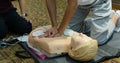 First aid cardiopulmonary resuscitation course using automated external defibrillator device - AED training. selective focus Royalty Free Stock Photo