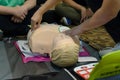 First aid cardiopulmonary resuscitation course using automated external defibrillator device - AED training. selective focus Royalty Free Stock Photo