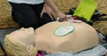 First aid cardiopulmonary resuscitation course using automated external defibrillator device - AED training. selective focus Royalty Free Stock Photo