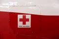 First aid cross and first aid inside title on a metal cabinet door
